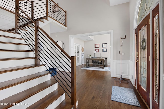 7006 Breakwater Pl, Prospect, KY 40059 - entrance foyer featuring french doors, wood finished floors, stairs, a towering ceiling, and a wainscoted wall