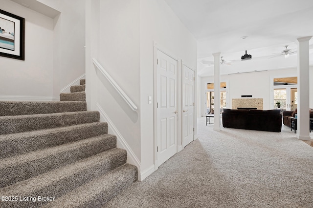 7006 Breakwater Pl, Prospect, KY 40059 - staircase with a ceiling fan, a fireplace, carpet, and baseboards
