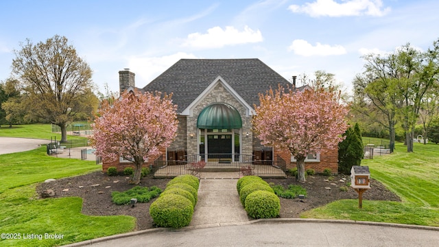 7006 Breakwater Pl, Prospect, KY 40059 - view of front facade with stone siding, a front lawn, and a chimney