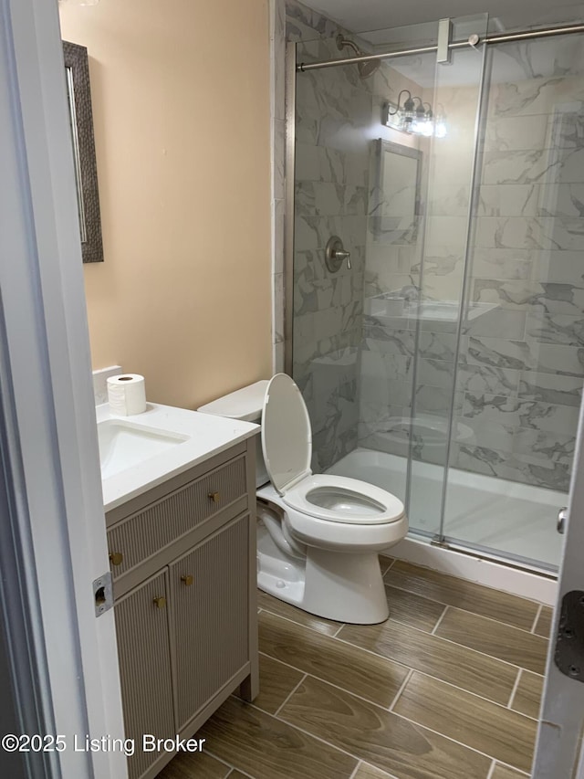 2532 Garland Ave, Louisville, KY 40211 - bathroom featuring a marble finish shower, toilet, and vanity