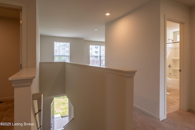 7618 Fair Ln, Louisville, KY 40291 - corridor with an upstairs landing, healthy amount of natural light, recessed lighting, and baseboards