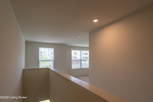 7618 Fair Ln, Louisville, KY 40291 - hall with recessed lighting, baseboards, and an upstairs landing