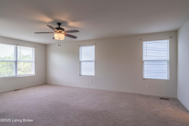 7618 Fair Ln, Louisville, KY 40291 - spare room featuring light carpet, a ceiling fan, and baseboards