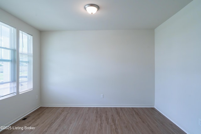 7618 Fair Ln, Louisville, KY 40291 - empty room featuring wood finished floors and baseboards