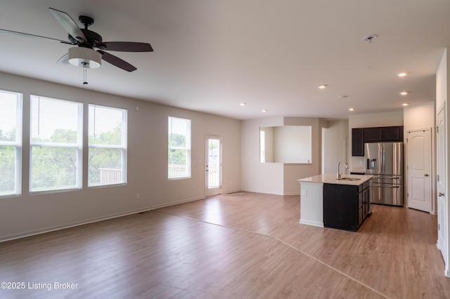 7618 Fair Ln, Louisville, KY 40291 - kitchen with stainless steel fridge with ice dispenser, a sink, open floor plan, an island with sink, and recessed lighting