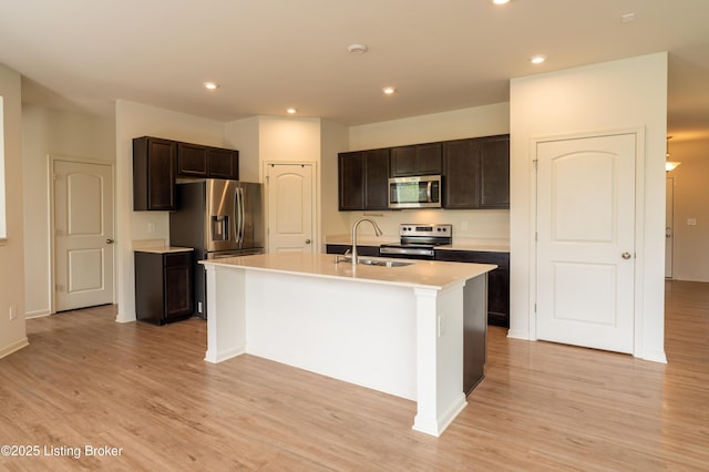 7618 Fair Ln, Louisville, KY 40291 - kitchen with stainless steel appliances, light wood-style flooring, dark brown cabinetry, light countertops, and recessed lighting