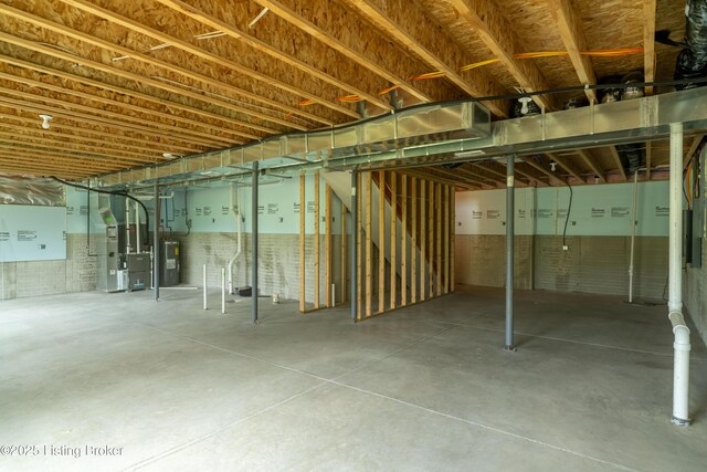7618 Fair Ln, Louisville, KY 40291 - unfinished basement featuring heating unit, electric water heater, and stairs