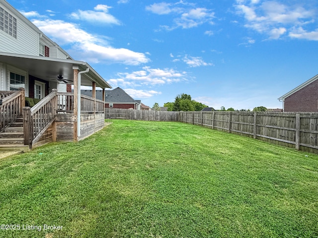 view of yard featuring a ceiling fan
