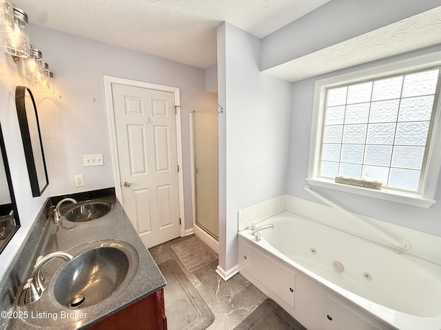 bathroom with a whirlpool tub, a stall shower, double vanity, and marble look tiles