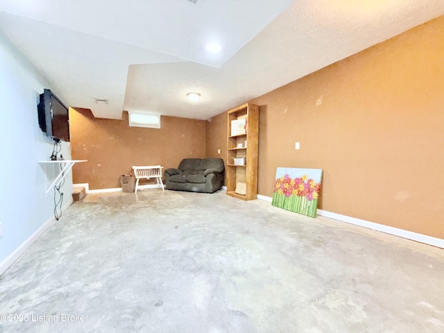 unfurnished room featuring unfinished concrete floors