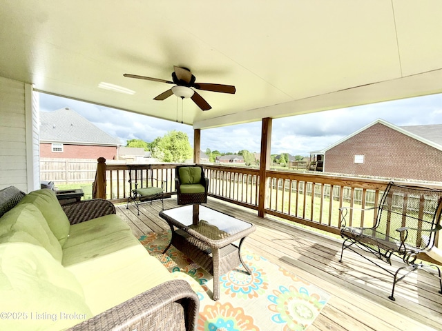 deck with ceiling fan and outdoor lounge area