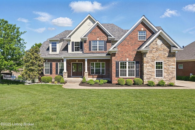 3403 Heather Wood Dr, La Grange, KY 40031 - craftsman house featuring a front lawn, brick siding, a porch, and a shingled roof