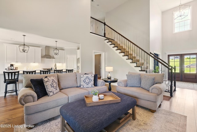 3403 Heather Wood Dr, La Grange, KY 40031 - living room with a high ceiling, light wood finished floors, stairs, and healthy amount of natural light