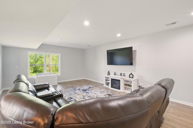 3403 Heather Wood Dr, La Grange, KY 40031 - living area with baseboards, light wood-type flooring, recessed lighting, and a glass covered fireplace
