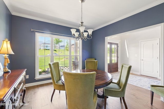 3403 Heather Wood Dr, La Grange, KY 40031 - dining area featuring a chandelier, crown molding, wood finished floors, and baseboards