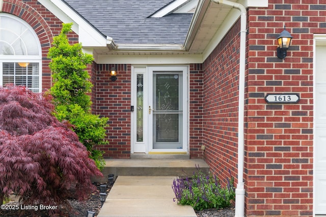 1613 E Crystal Dr, La Grange, KY 40031 - doorway to property featuring roof with shingles and brick siding