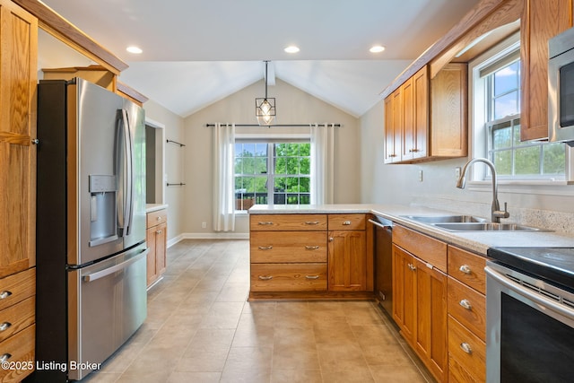 1613 E Crystal Dr, La Grange, KY 40031 - kitchen with appliances with stainless steel finishes, a sink, plenty of natural light, brown cabinetry, and vaulted ceiling