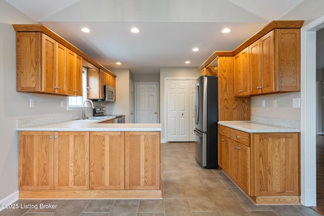1613 E Crystal Dr, La Grange, KY 40031 - kitchen featuring appliances with stainless steel finishes, a sink, vaulted ceiling, recessed lighting, and light countertops