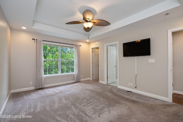 1613 E Crystal Dr, La Grange, KY 40031 - unfurnished bedroom with a tray ceiling, recessed lighting, baseboards, carpet floors, and a ceiling fan