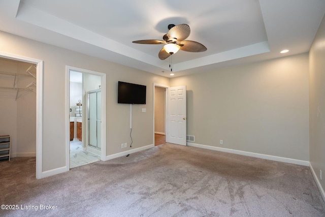 1613 E Crystal Dr, La Grange, KY 40031 - unfurnished bedroom with a tray ceiling, a spacious closet, carpet floors, and recessed lighting