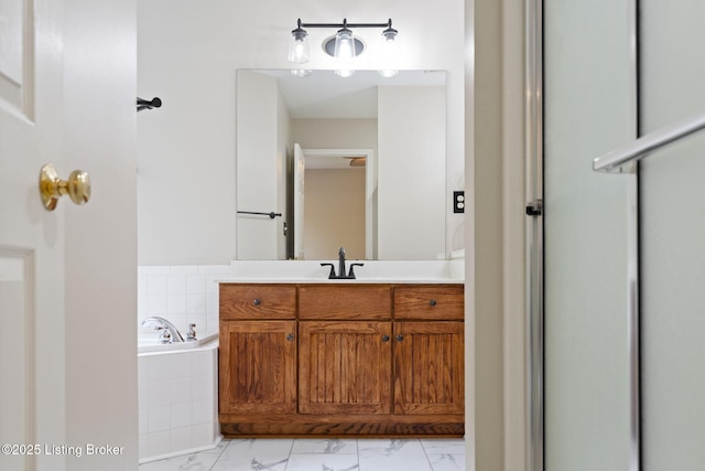 1613 E Crystal Dr, La Grange, KY 40031 - bathroom with marble look tile flooring, a bath, and vanity