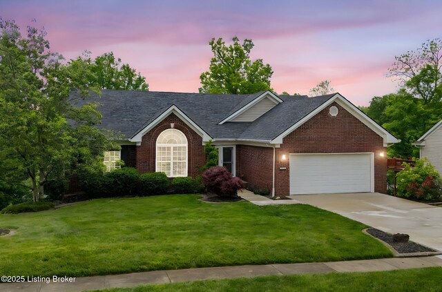1613 E Crystal Dr, La Grange, KY 40031 - view of front of house featuring an attached garage, brick siding, a yard, concrete driveway, and roof with shingles