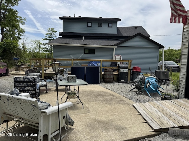 3031 Beech Grove Rd, Lebanon Junction, KY 40150 - rear view of property with roof with shingles, an outdoor living space, a patio, and a wooden deck