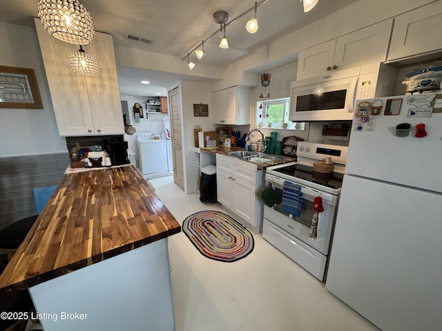 3031 Beech Grove Rd, Lebanon Junction, KY 40150 - kitchen featuring white appliances, butcher block countertops, washer / dryer, a sink, and white cabinetry
