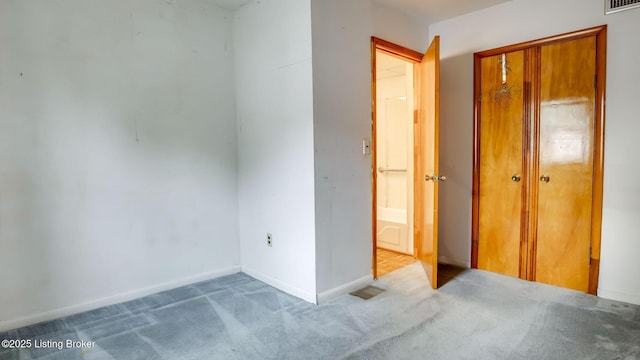 4011 Crawford Ave, Louisville, KY 40218 - unfurnished bedroom featuring carpet, a closet, and baseboards