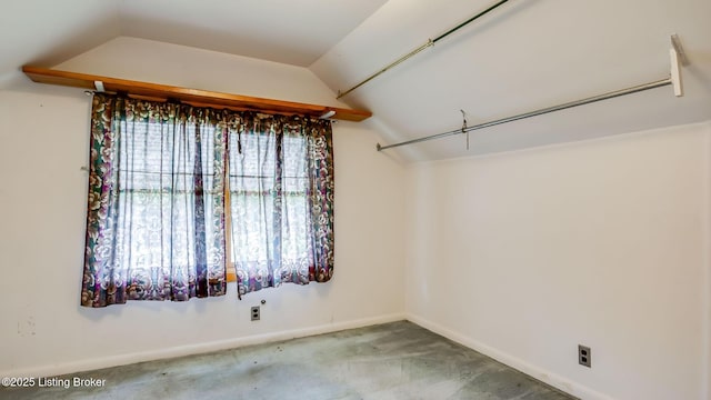 4011 Crawford Ave, Louisville, KY 40218 - walk in closet with carpet floors and lofted ceiling