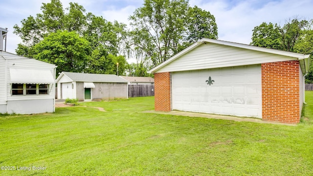 4011 Crawford Ave, Louisville, KY 40218 - view of yard featuring a garage and an outbuilding