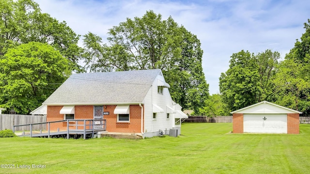4011 Crawford Ave, Louisville, KY 40218 - rear view of house with an outdoor structure, a garage, roof with shingles, central AC unit, and brick siding
