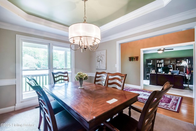 6516 Norman Ct, Crestwood, KY 40014 - dining area featuring a raised ceiling, healthy amount of natural light, a chandelier, crown molding, and baseboards