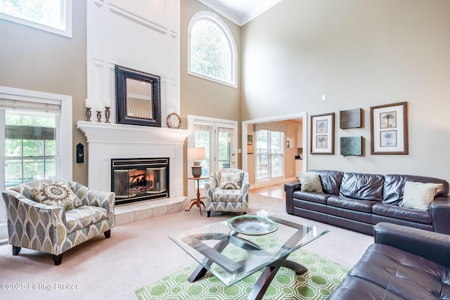 6516 Norman Ct, Crestwood, KY 40014 - living area with a tiled fireplace, carpet flooring, a towering ceiling, healthy amount of natural light, and ornamental molding