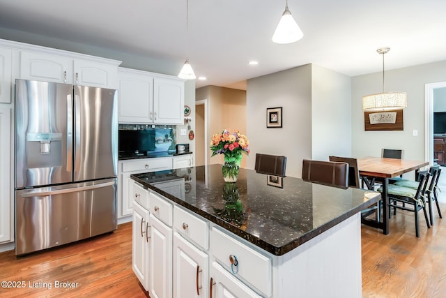 6516 Norman Ct, Crestwood, KY 40014 - kitchen featuring stainless steel refrigerator with ice dispenser, light wood-type flooring, white cabinetry, hanging light fixtures, and a kitchen island