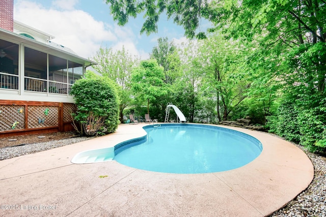 6516 Norman Ct, Crestwood, KY 40014 - swimming pool with a water slide, a patio area, and a sunroom