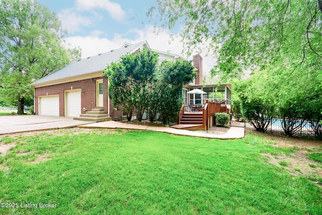 6516 Norman Ct, Crestwood, KY 40014 - view of front of house with concrete driveway, a sunroom, brick siding, an attached garage, and a deck