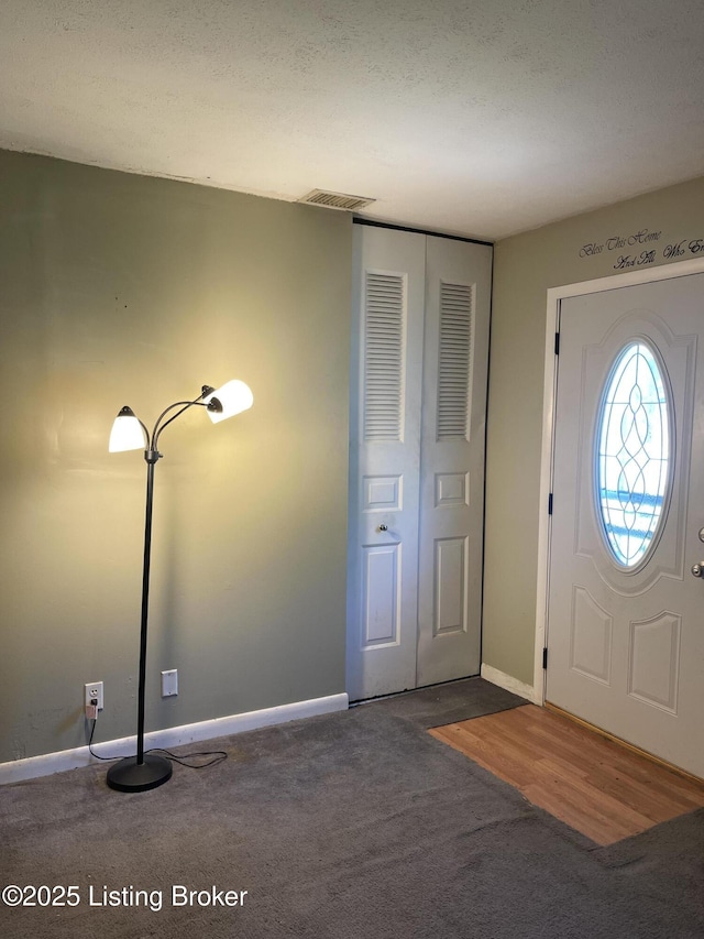 1310 Lacona Ln, Louisville, KY 40213 - carpeted foyer with baseboards