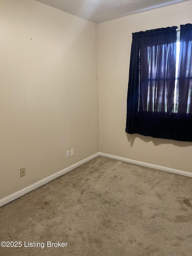 1310 Lacona Ln, Louisville, KY 40213 - carpeted spare room with baseboards