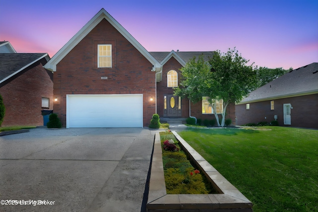7911 Windgate Dr, Louisville, KY 40291 - traditional home featuring an attached garage, concrete driveway, a front lawn, and brick siding