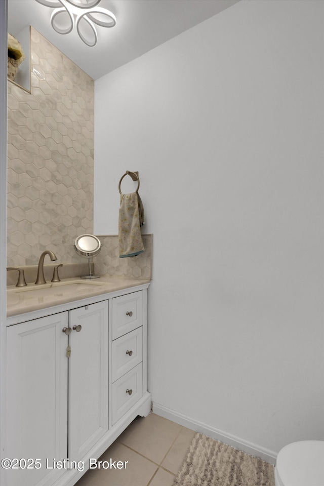7911 Windgate Dr, Louisville, KY 40291 - bathroom with tile patterned floors, vanity, toilet, and baseboards