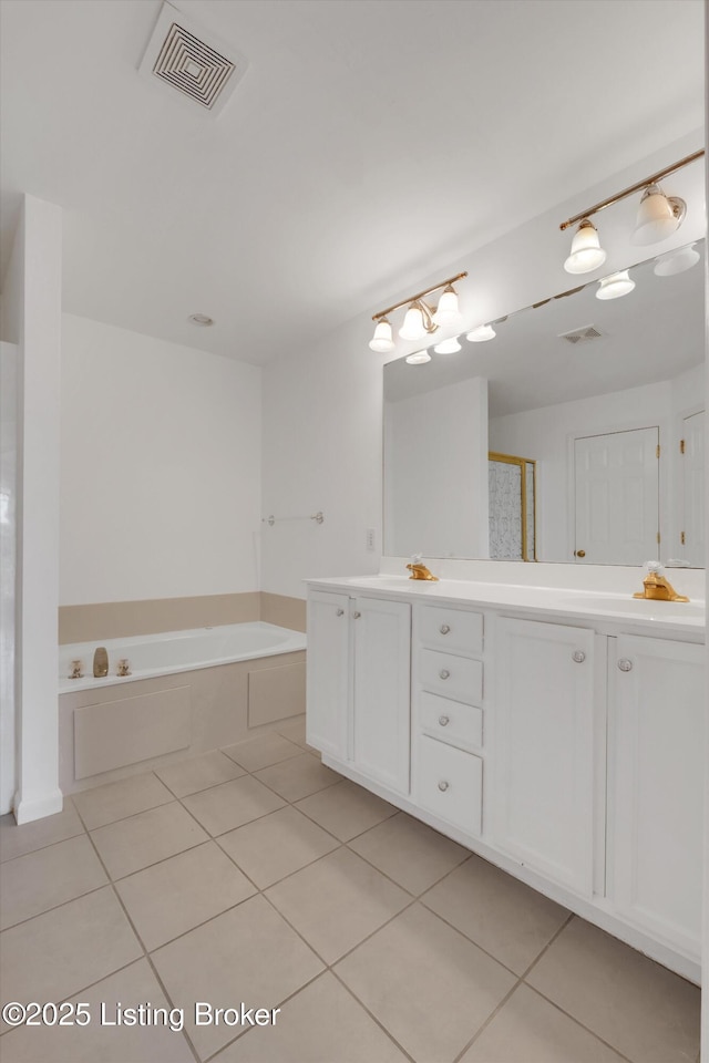 7911 Windgate Dr, Louisville, KY 40291 - full bath featuring tile patterned flooring, double vanity, and a garden tub