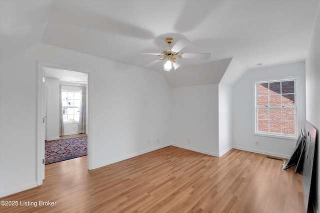 7911 Windgate Dr, Louisville, KY 40291 - additional living space featuring light wood finished floors, a ceiling fan, lofted ceiling, and baseboards