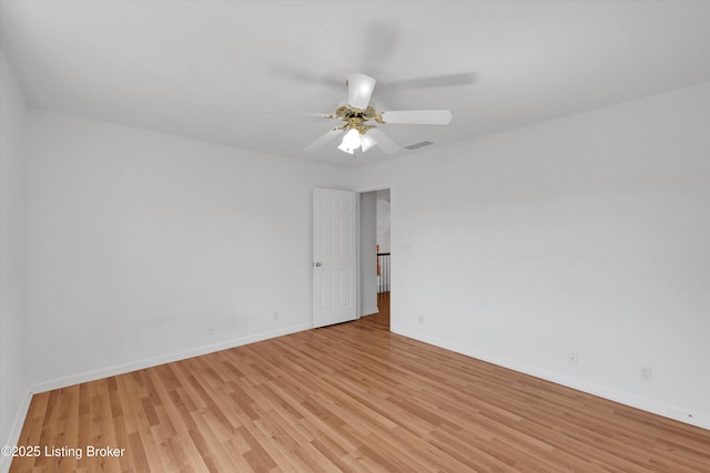 7911 Windgate Dr, Louisville, KY 40291 - spare room featuring light wood-style flooring, baseboards, and ceiling fan