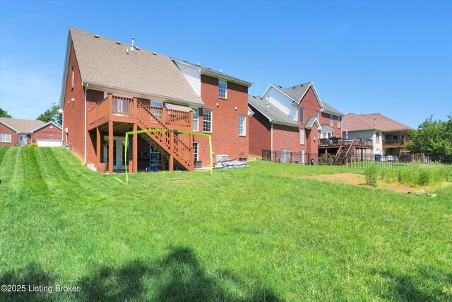 7911 Windgate Dr, Louisville, KY 40291 - back of house with stairs, a wooden deck, brick siding, and roof with shingles