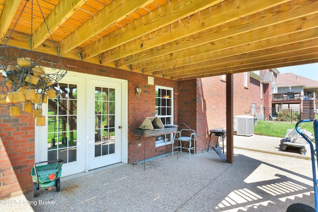 7911 Windgate Dr, Louisville, KY 40291 - view of patio / terrace with french doors, central AC, and fence