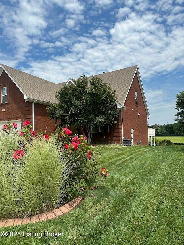7911 Windgate Dr, Louisville, KY 40291 - view of home's exterior with a yard and a shingled roof