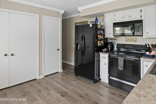 2010 Beech Grove Rd, Shepherdsville, KY 40165 - kitchen with black appliances, wood finished floors, white cabinets, ornamental molding, and a textured ceiling