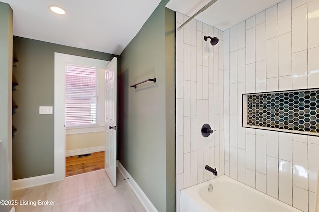 1228 S Floyd St, Louisville, KY 40203 - full bathroom featuring baseboards, bathing tub / shower combination, and recessed lighting
