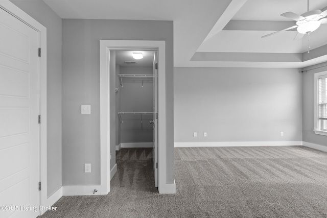 182 Washington Commons Dr, Mt Washington, KY 40047 - unfurnished bedroom featuring carpet flooring, a walk in closet, baseboards, a closet, and a ceiling fan